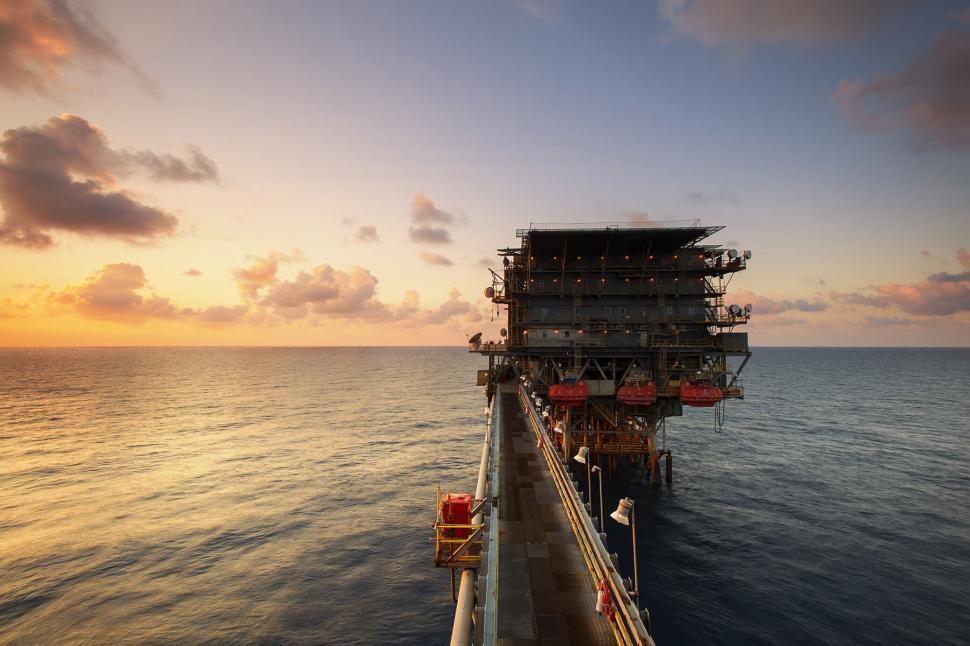 Free Image of Offshore oil platform at golden hour 