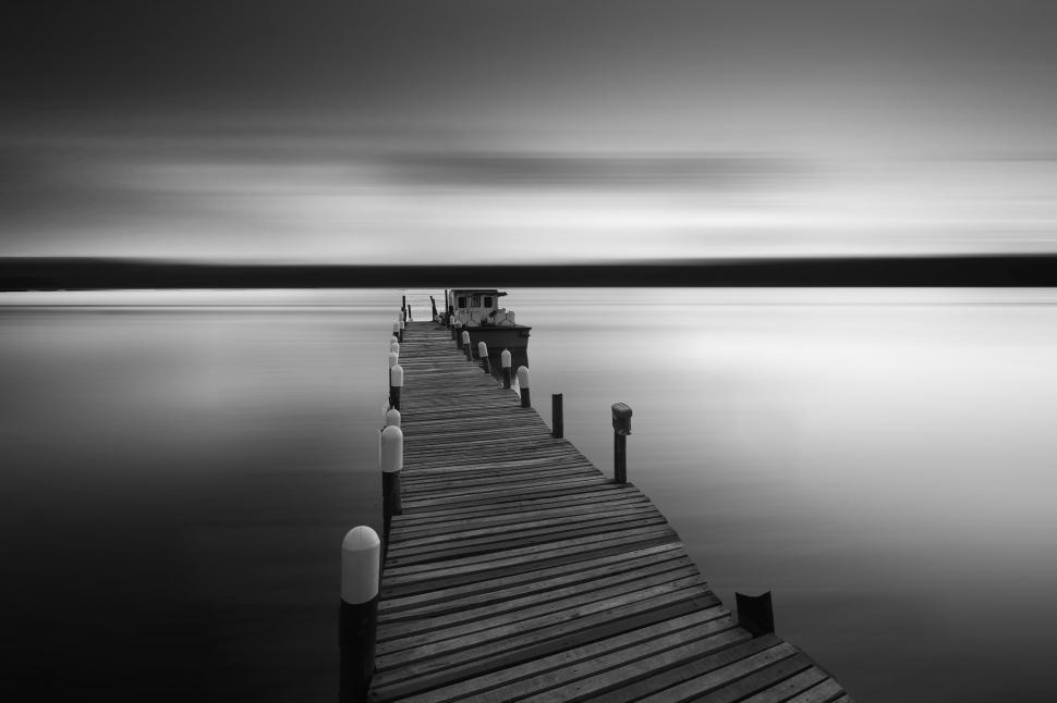 Free Image of Black and white long exposure of a pier 