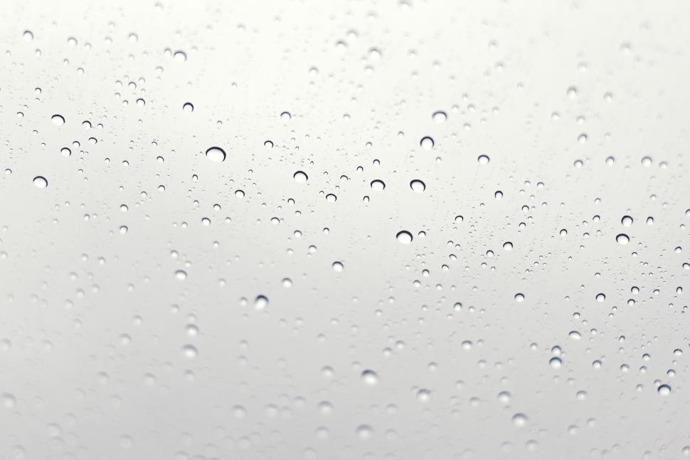 Free Image of Raindrops on a window glass close-up 