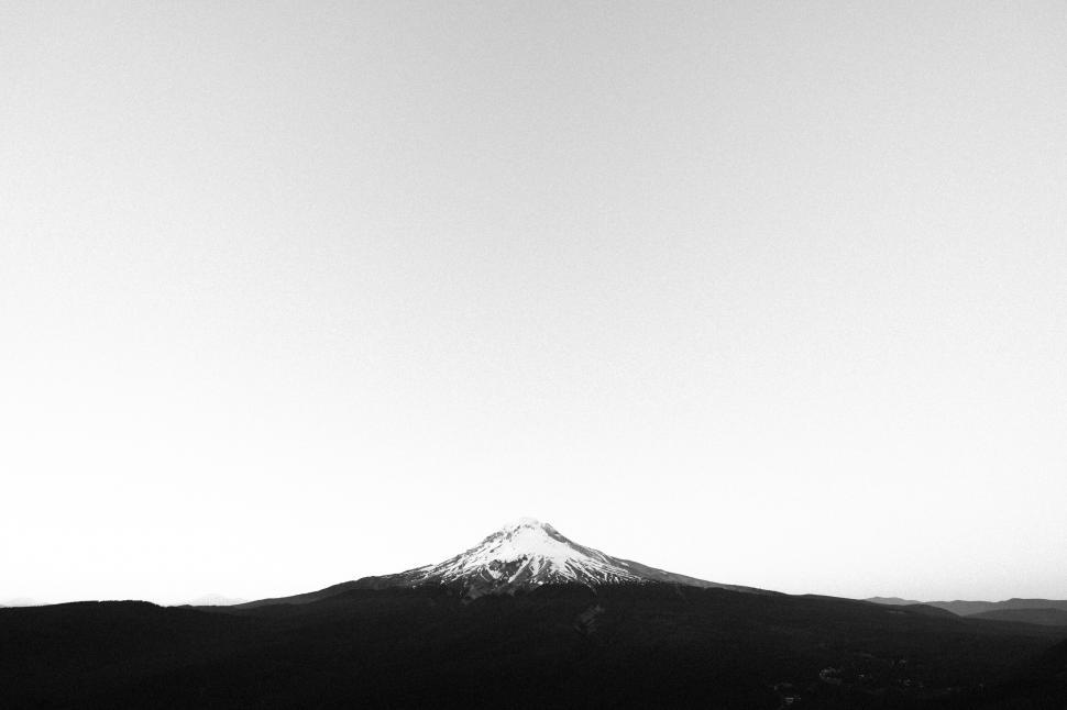 Free Image of Monochrome mountain peak against sky 