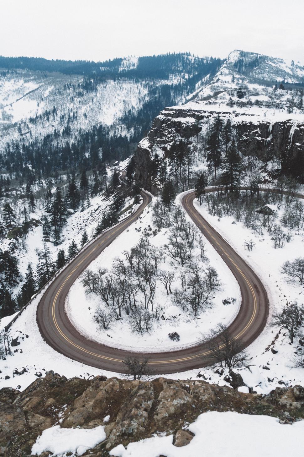 Free Image of Snowy hairpin road in mountain landscape 