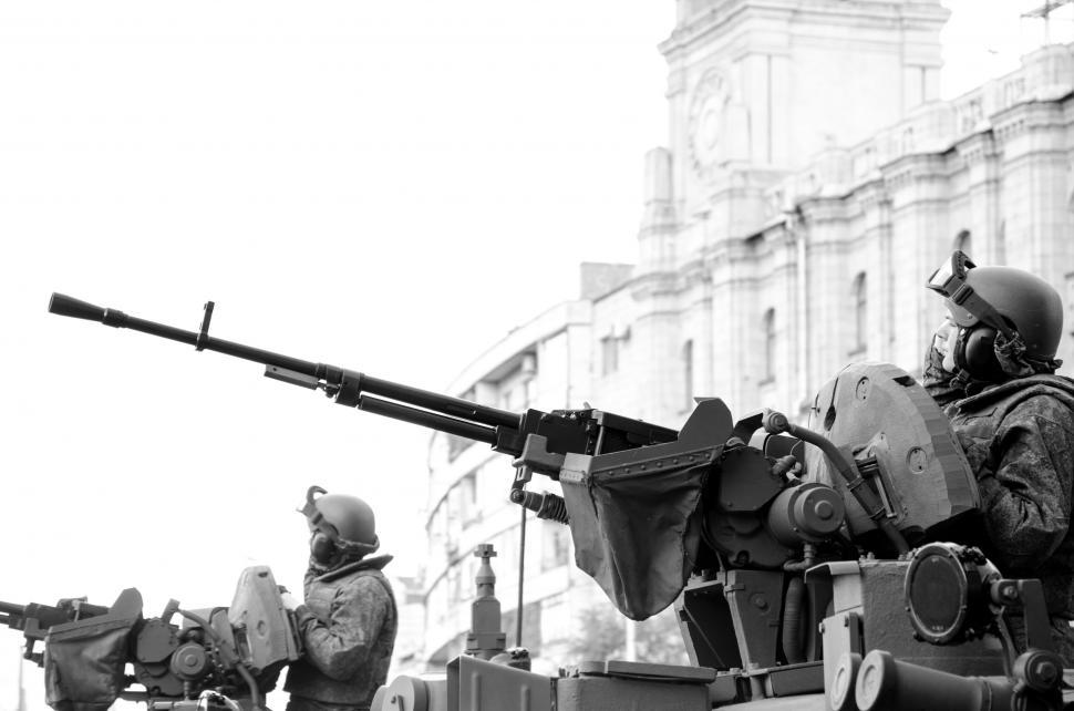 Free Image of Military personnel operating an anti-aircraft gun 