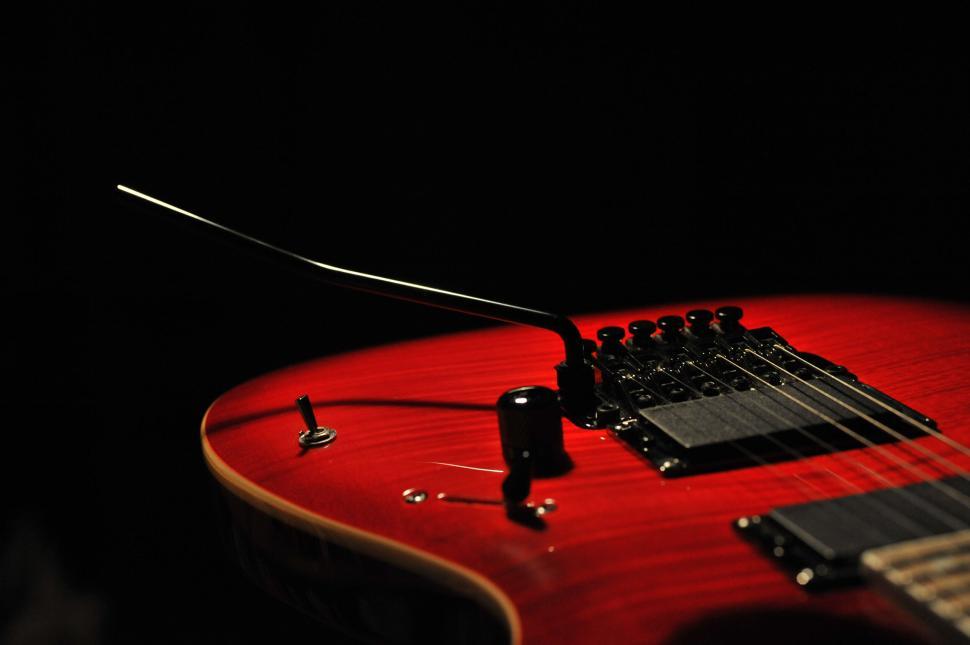Free Image of Close-up of a red electric guitar 
