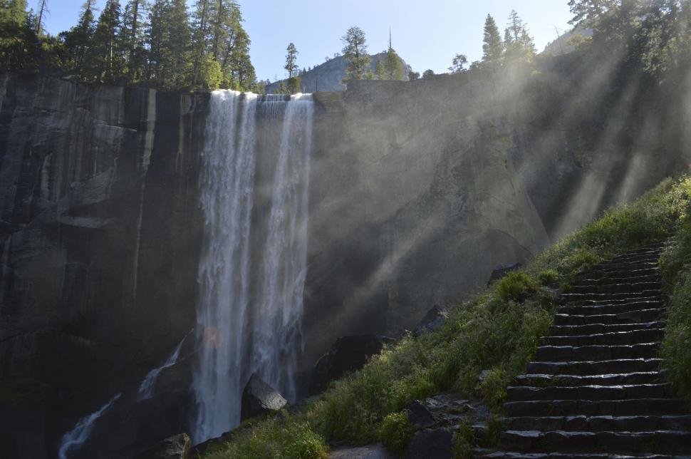 Free Image of Misty waterfall with ray of sunlight 