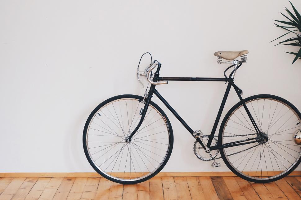Free Image of Vintage bicycle against white wall 