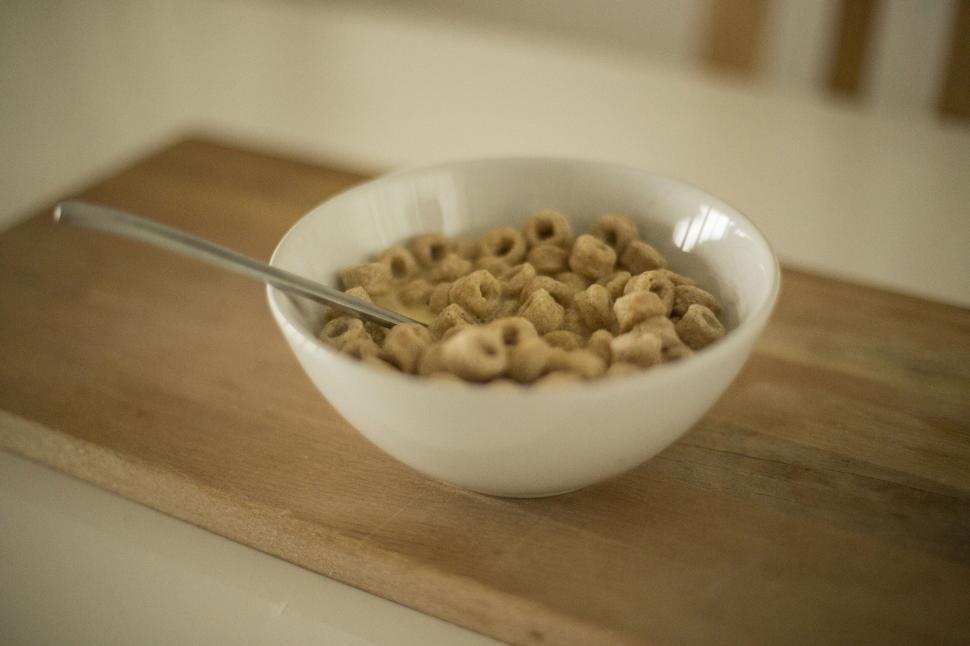 Free Image of Bowl of cereal on a wooden table 