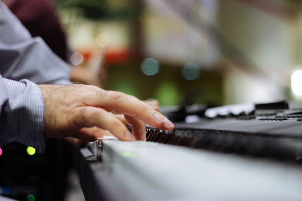Free Image of Close-up of hands playing piano 