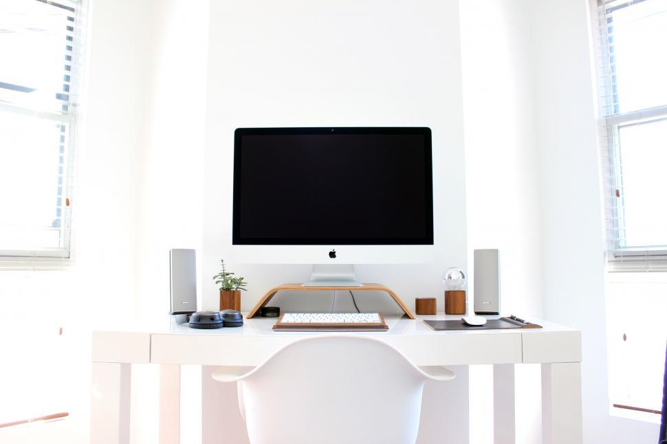 Free Image of Modern workspace with Apple computer setup 