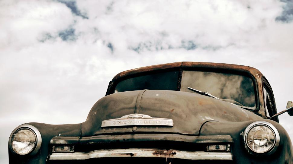 Free Image of Vintage Chevrolet truck under cloudy sky 