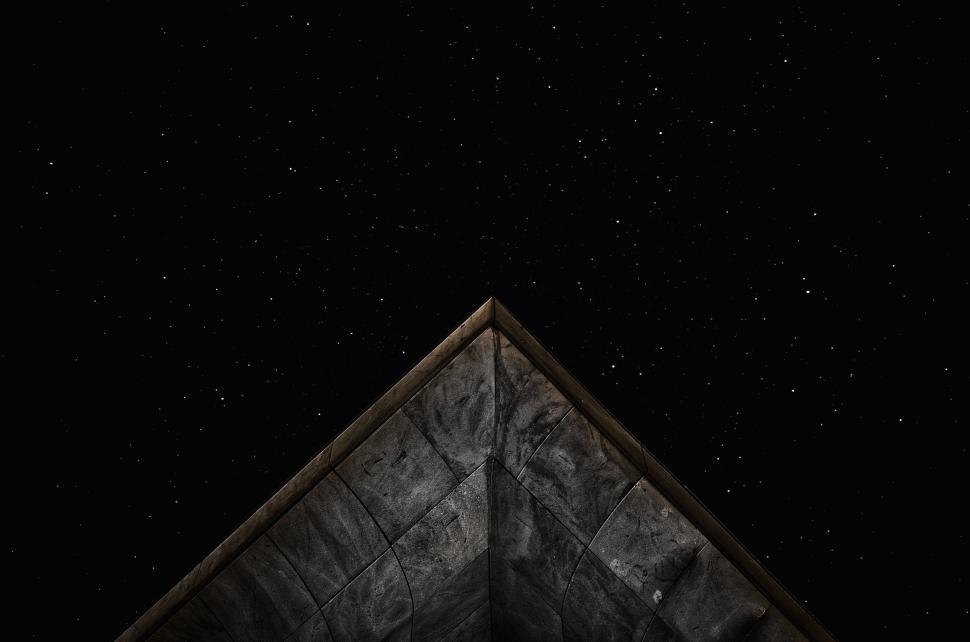 Free Image of Triangular building corner against starry night 