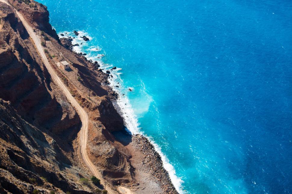 Free Image of Cliffside ocean road with azure waters 
