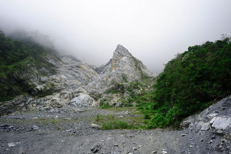 Free Image of Foggy mountain landscape with rocky terrain 
