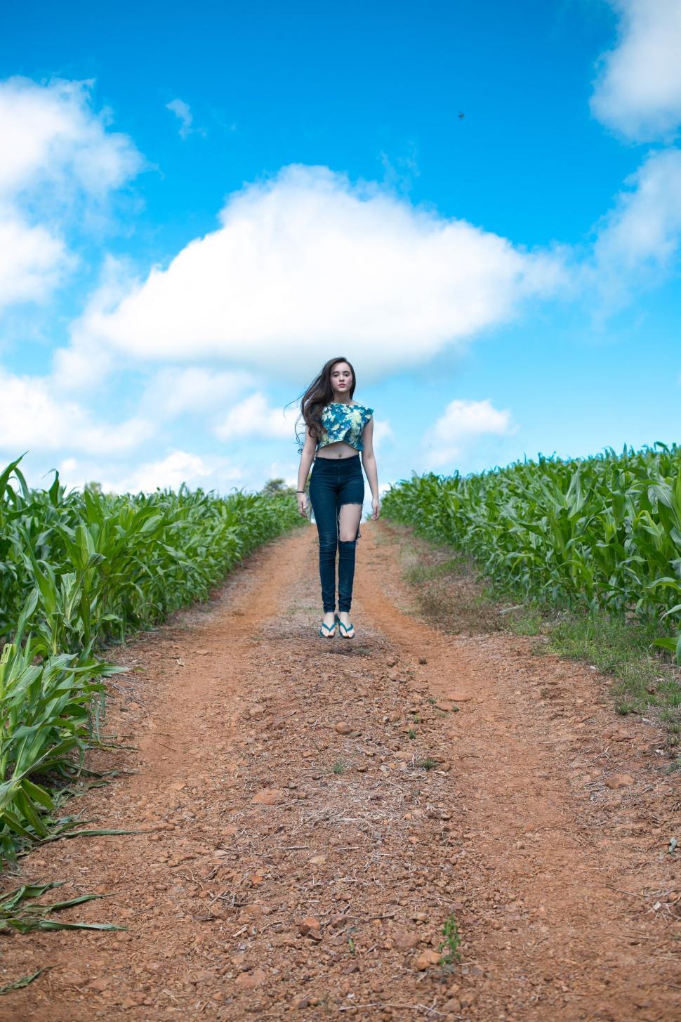 Free Image of Woman walking on a rural path 