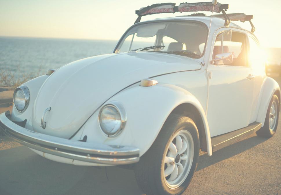 Free Image of Vintage white Volkswagen Beetle at sunset 