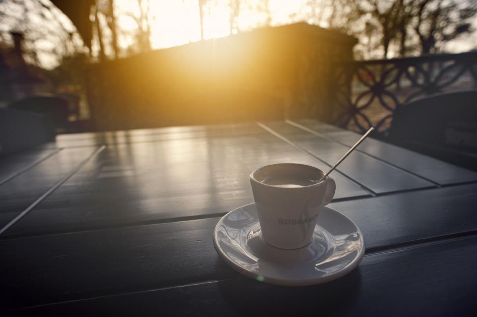 Free Image of Morning coffee cup on outdoor table 