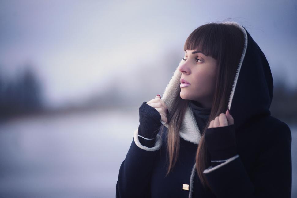 Free Image of Young woman in hooded coat in winter 