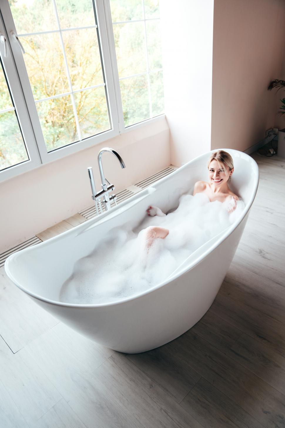 Free Image of A woman in a bathtub 