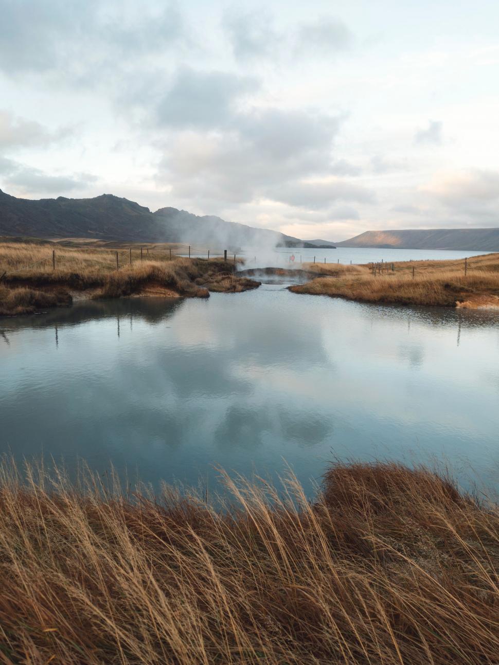 Free Image of Serene Lake Landscape with Geothermal Smoke 