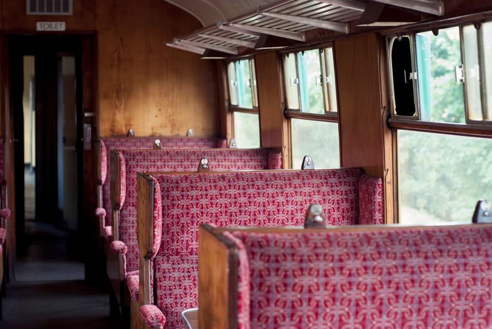 Free Image of Vintage train interior with red seats 