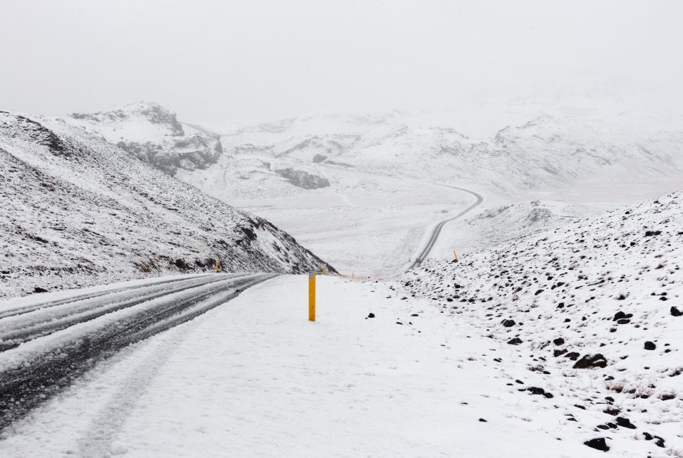 Free Image of Snowy winding road in mountain landscape 