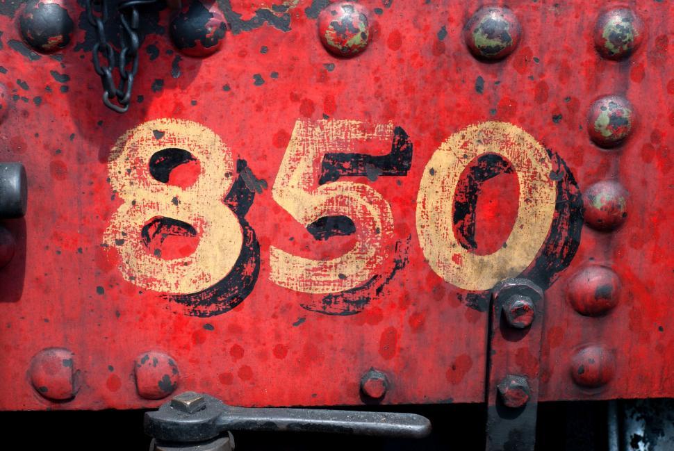 Free Image of Faded number 850 on a red background 