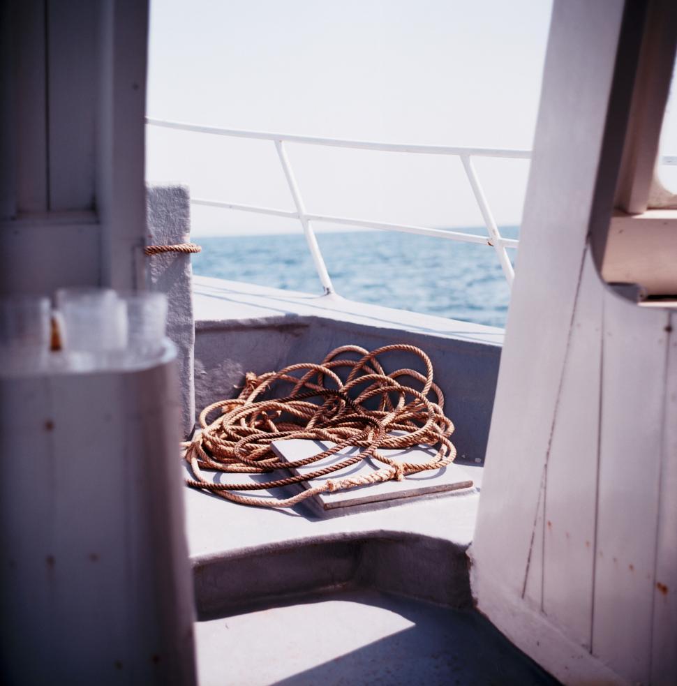 Free Image of Rope coiled on deck of a boat 