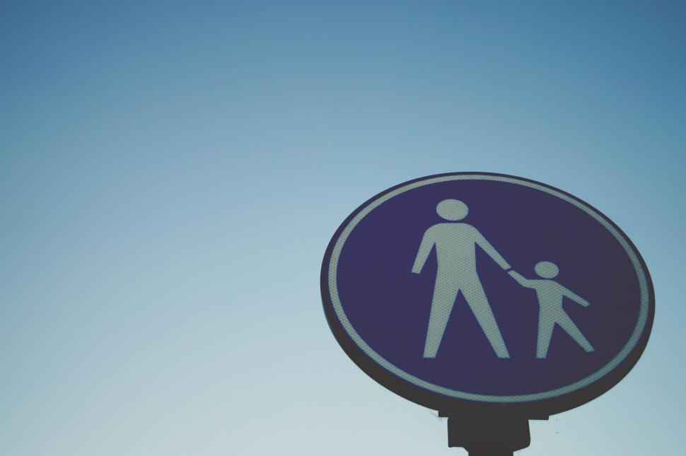 Free Image of Pedestrian sign against a clear sky 