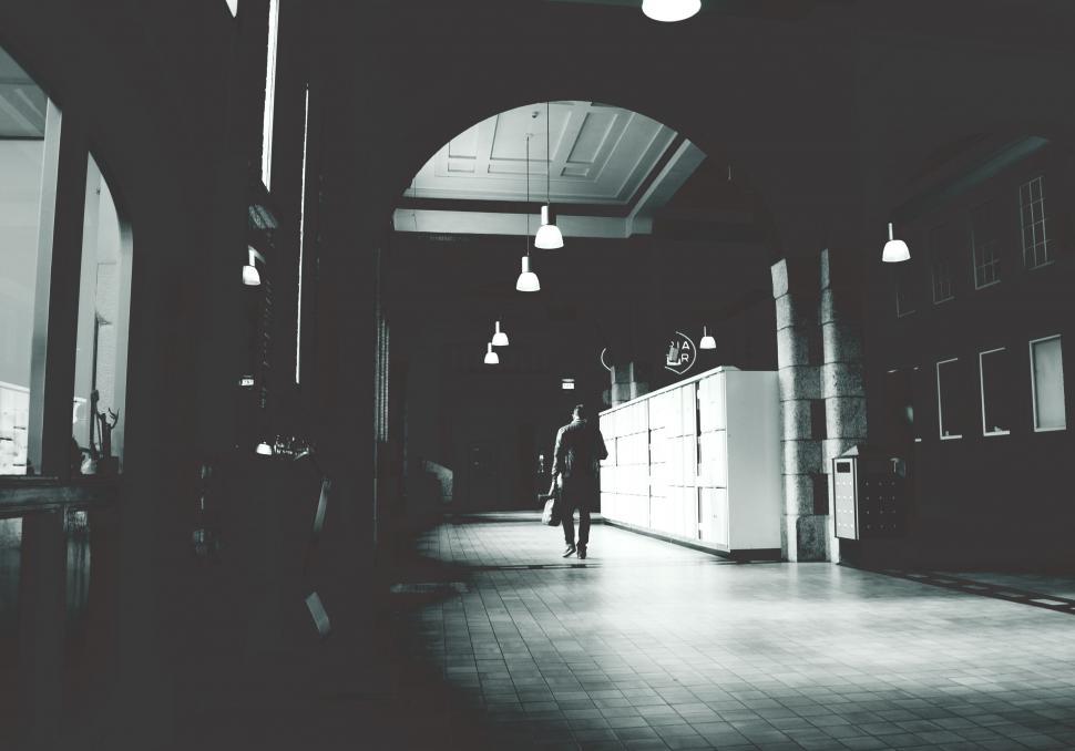 Free Image of Moody corridor with a lone figure walking 