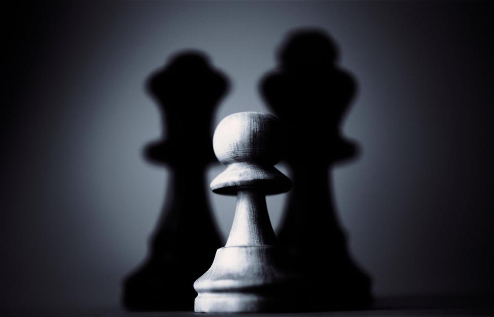 Free Image of Chess pieces in focus with moody backdrop 