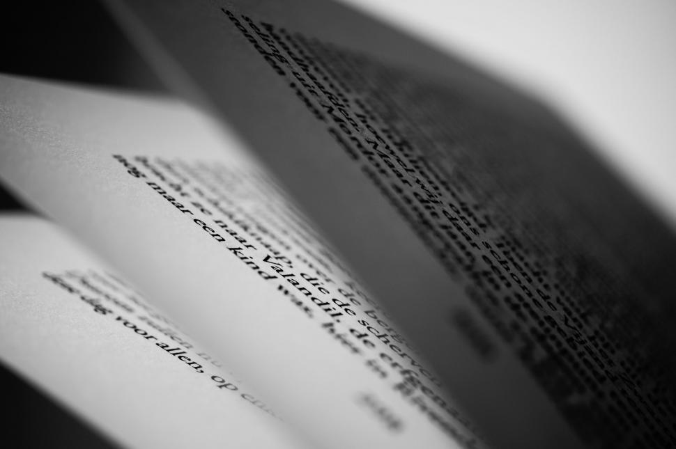 Free Image of Focused text on open book pages 
