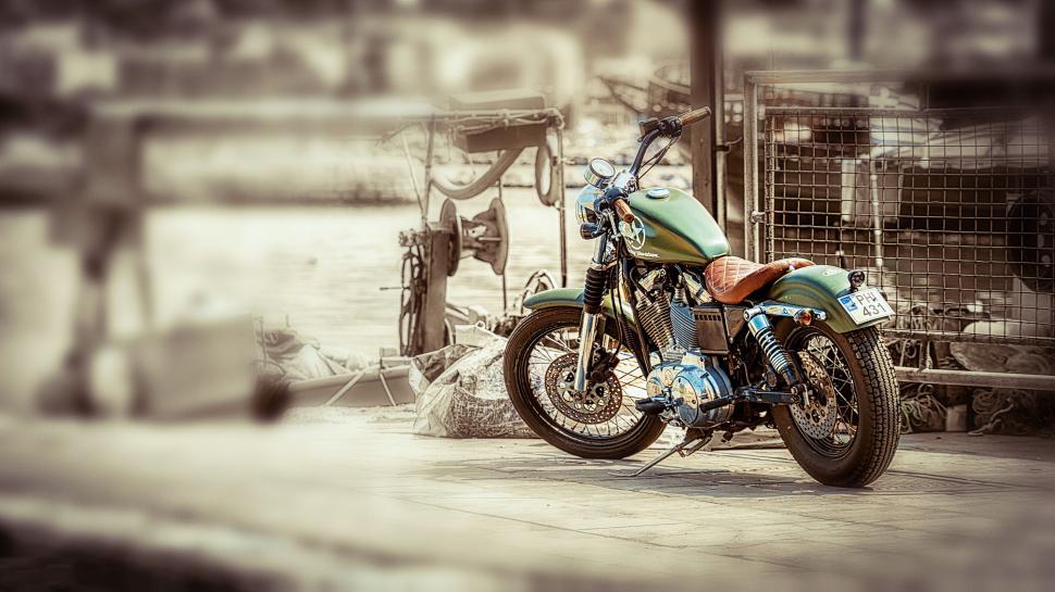 Free Image of Vintage motorcycle parked in urban setting 