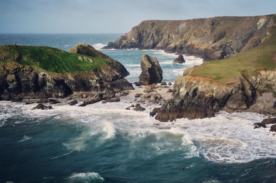 Free Image of Rugged coastline with crashing waves 