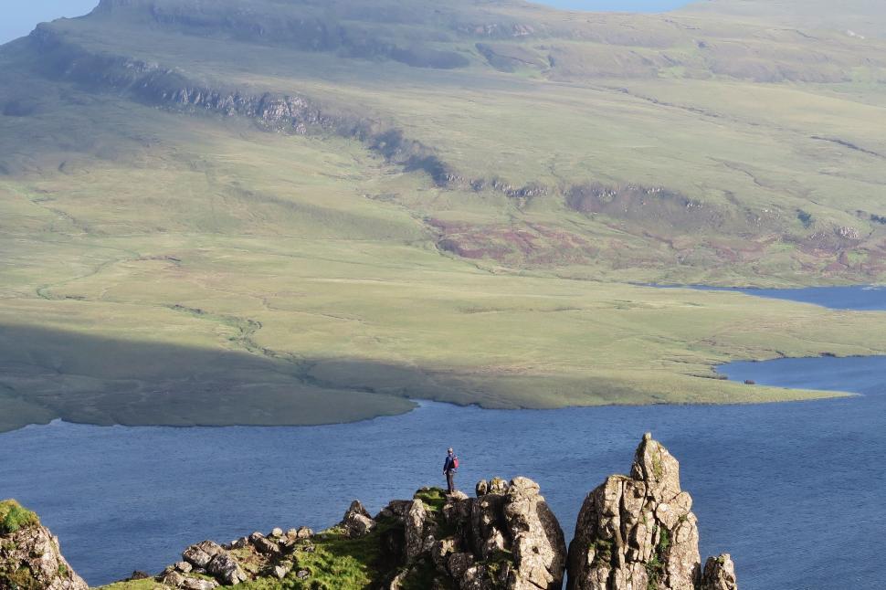 Free Image of Hiker observing vast mountain landscape 