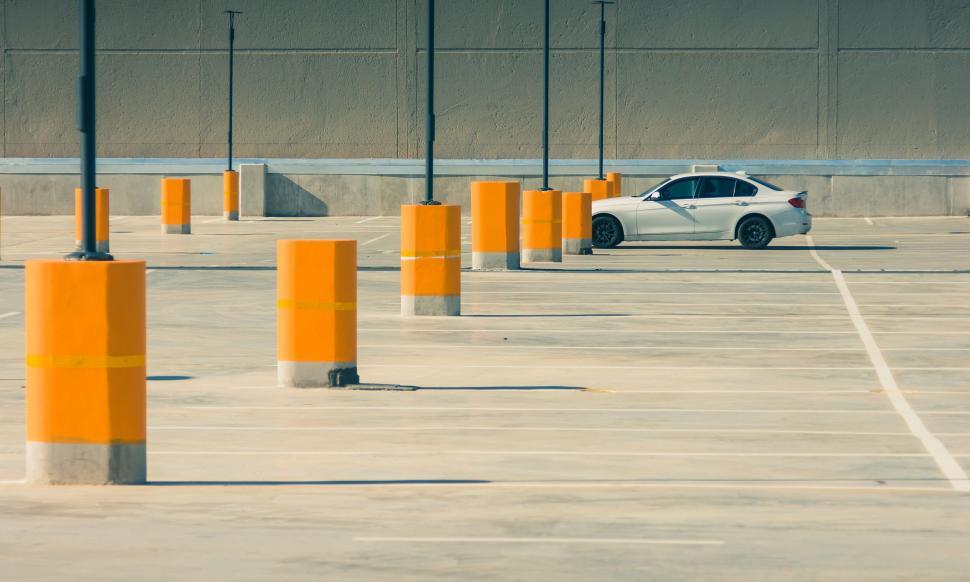 Free Image of Empty parking lot with single car 