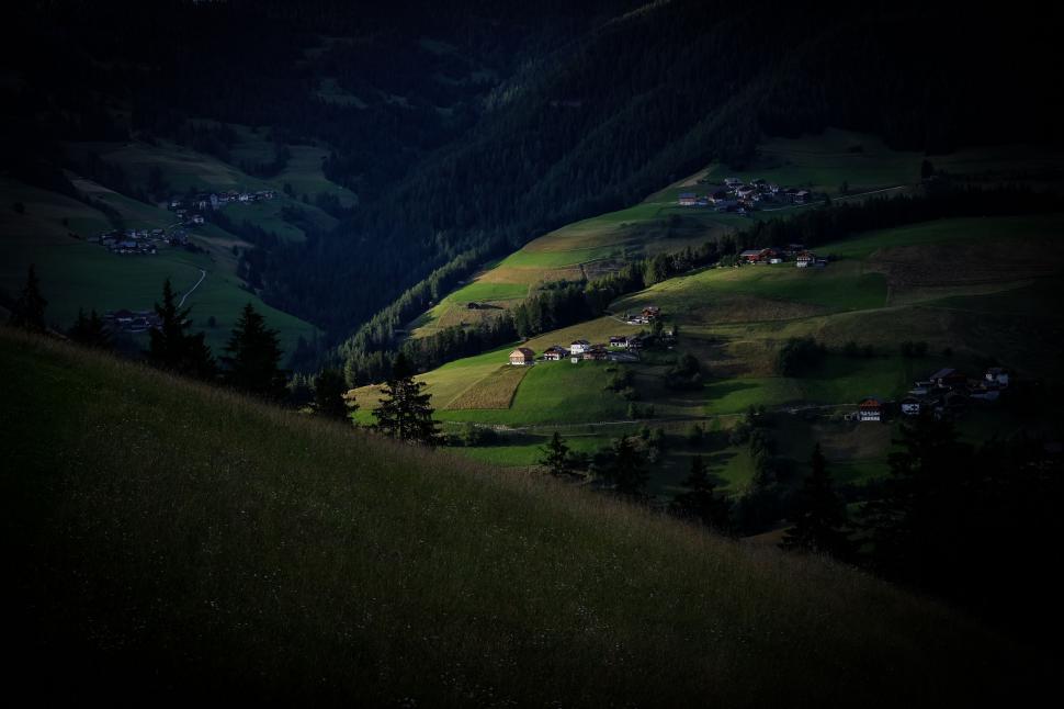 Free Image of Mountain village at dusk with spotlights 