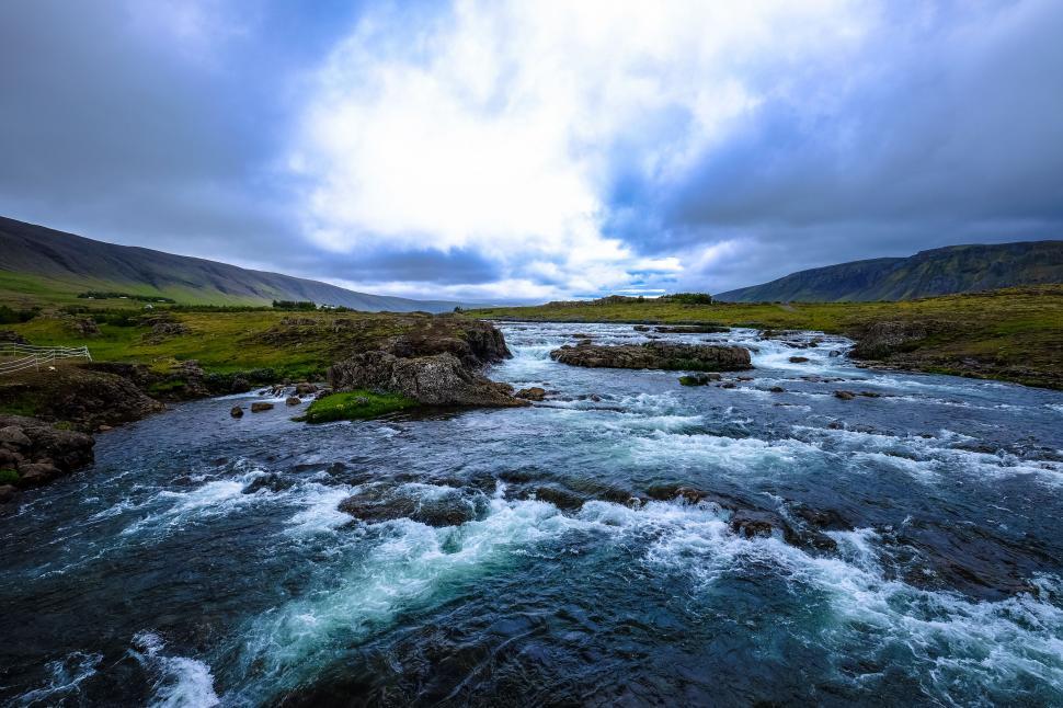 Free Image of Rushing river through rugged landscape 