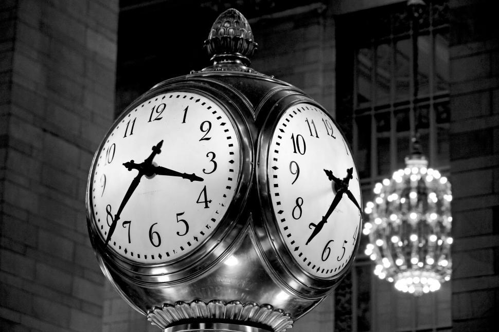 Free Image of Vintage four-faced clock with chandeliers 