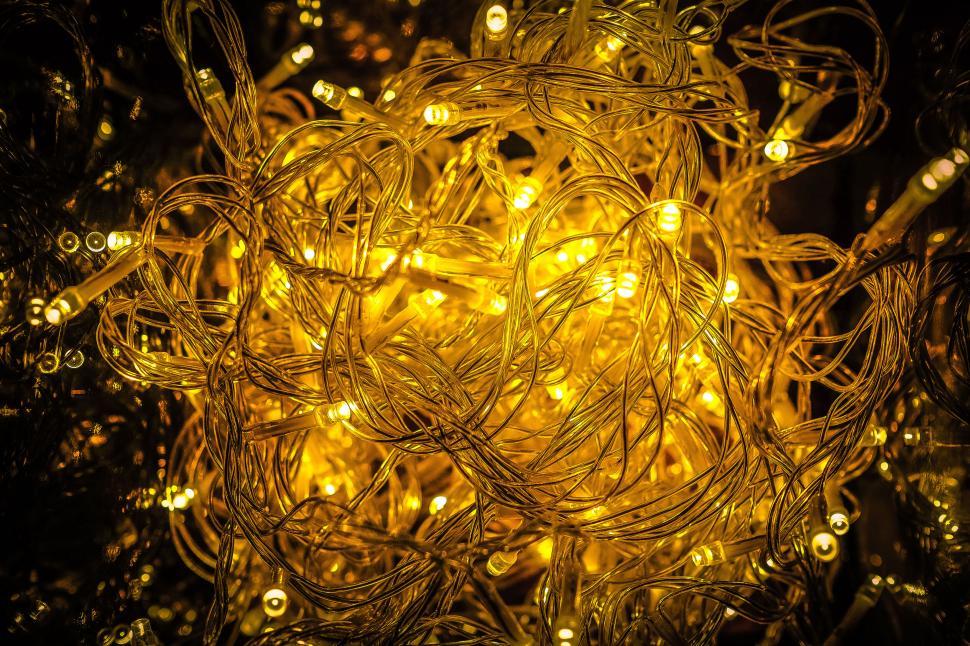 Free Image of Tangled string lights glowing warmly 