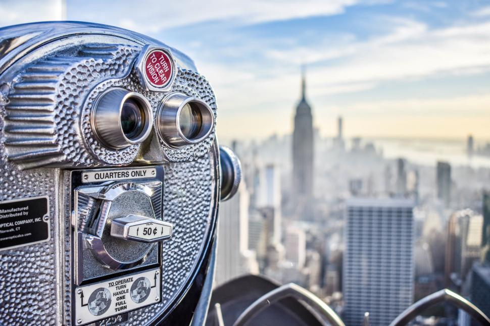 Free Image of Binocular viewer overlooking city skyline 