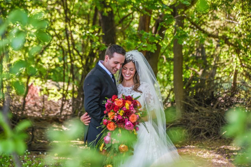 Free Image of Bride and groom sharing a moment in woods 