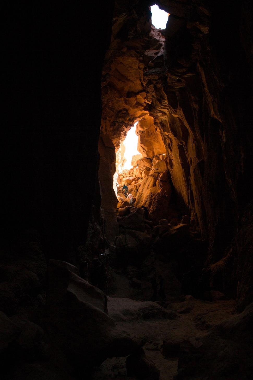 Free Image of Mysterious cave opening with natural light 