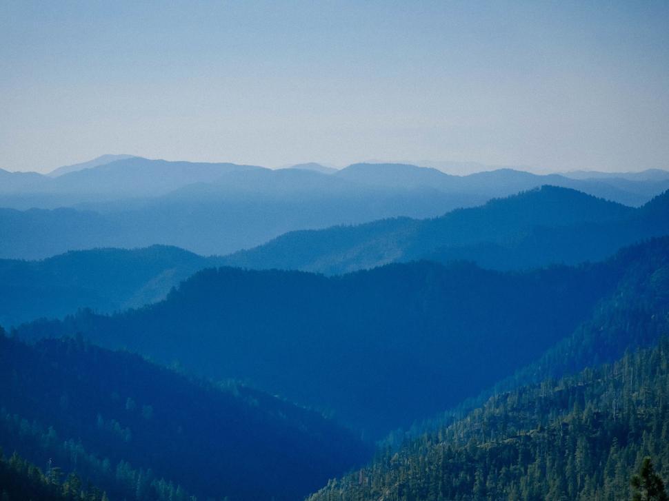 Free Image of Mountain ridges under blue gradient sky 