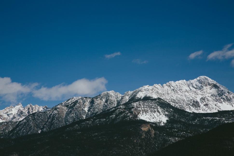 Free Image of Snow-Capped Mountains under Blue Sky 