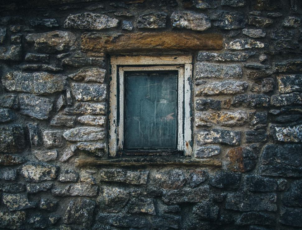 Free Image of Old stone wall with a wooden window 