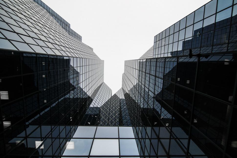Free Image of Looking up at symmetrical skyscrapers 