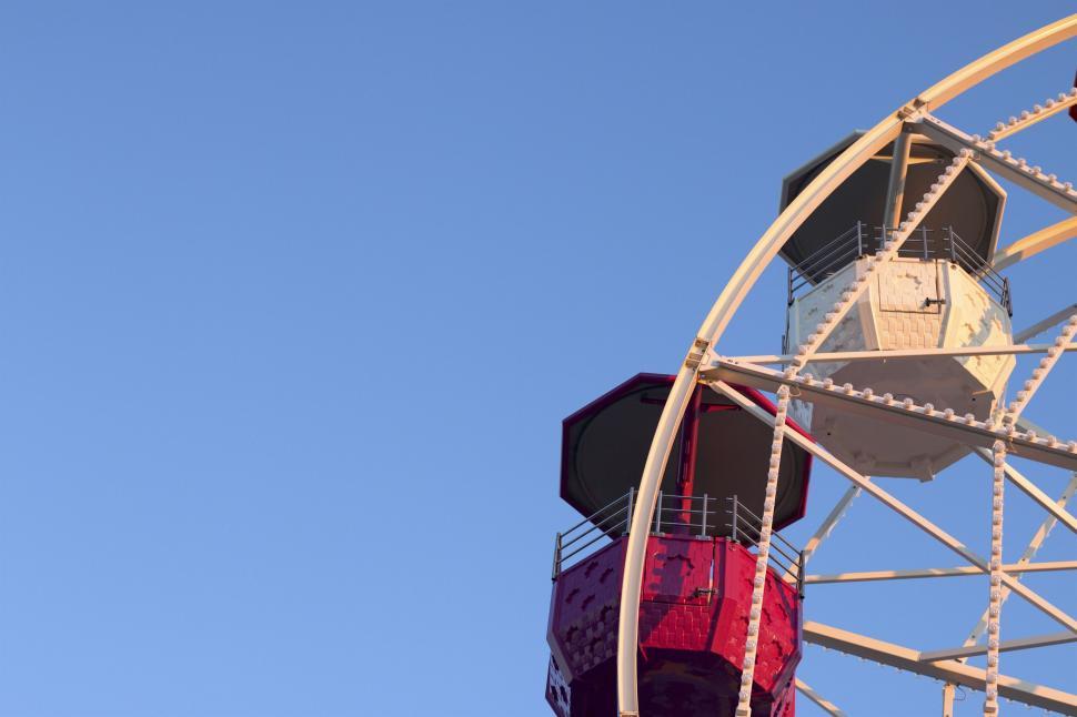 Free Image of Close-up of Ferris wheel against blue sky 