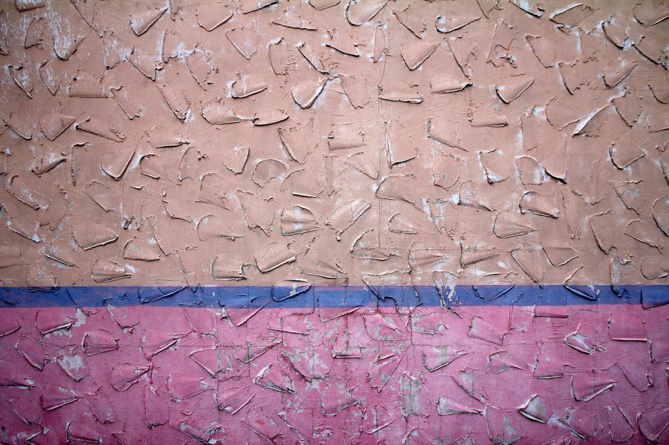Free Image of Textured wall with blue and pink peeling paint 
