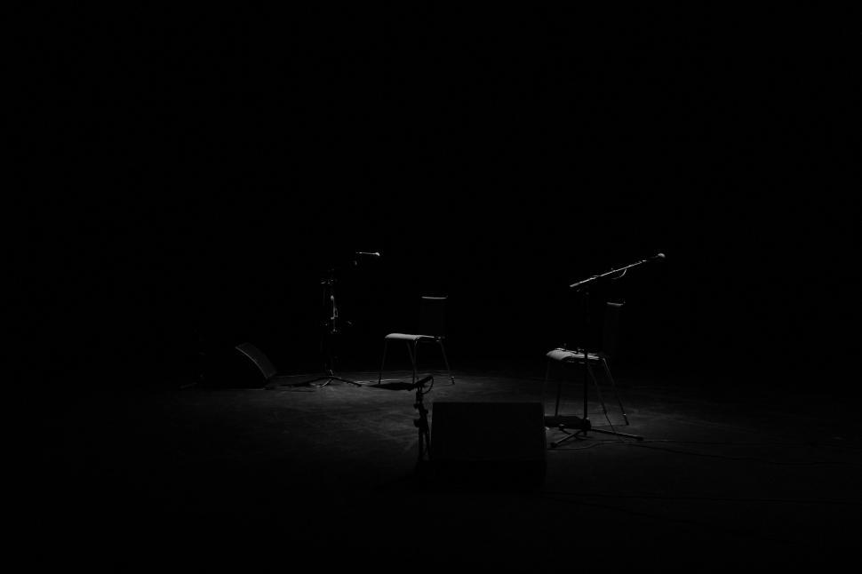 Free Image of Empty stage with musical equipment in darkness 
