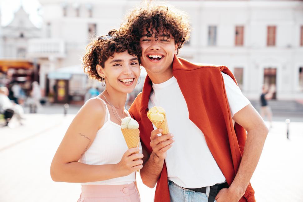 Free Image of A man and woman holding ice cream cones 