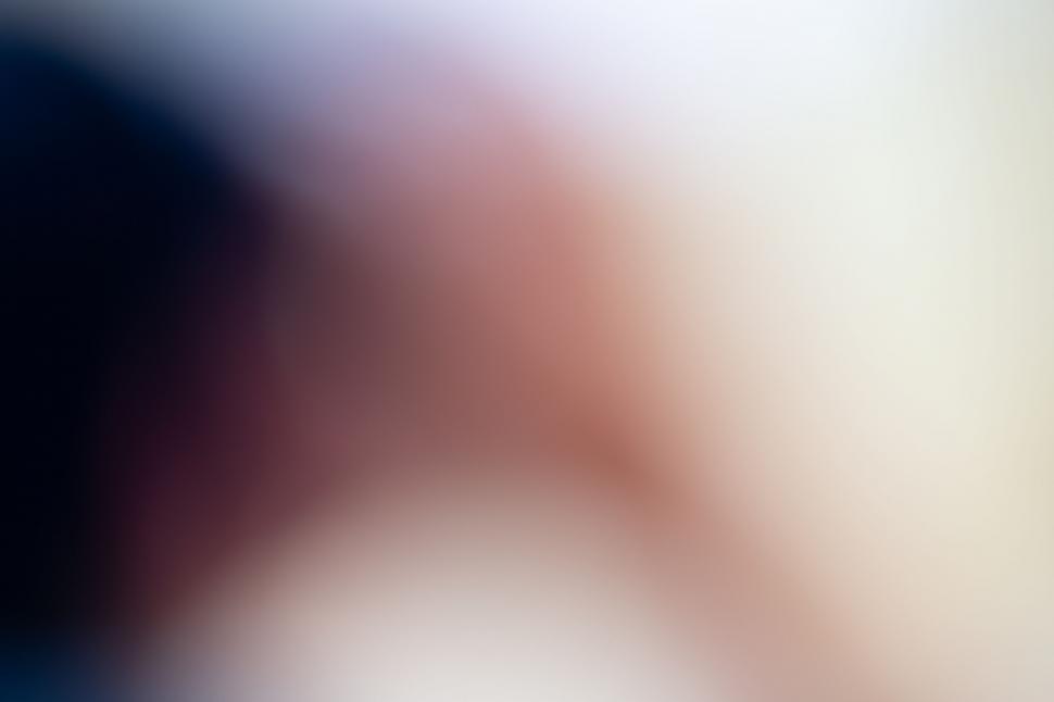 Free Image of Softly blurred peach and black tones 